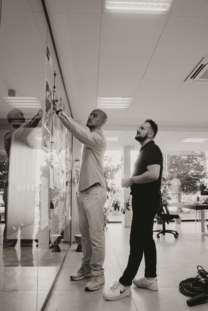 Team planning strategy on wall
